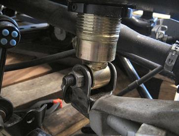Fabricated rear lower coilover mount was located to the original MX5 strut lower mount position.