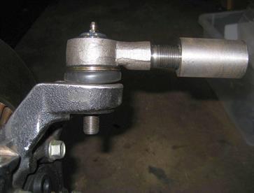 And here we have the result of the machining.  A Ford Transit Van tie rod end perfectly fitted to a Mazda MX5 upright.  You can also see the adapter sleeve that was machined for the upper wishbone.