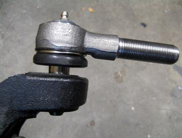 The Transit Van tie rod end had the same taper angle as the MX5 upright but the opening had to be enlarged (using a custom made tapered reamer) to allow the tie rod end to sit deeper into the MX5 upright and enable the retaining nut to be installed.  In the original condition it's sitting too high and there is not enough thread sticking through to put the nyloc nut on correctly.