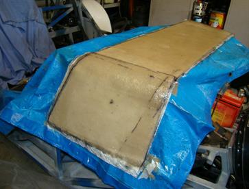 Fibreglass applied and we now have a mould waiting to be separated from the buck.
