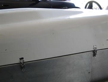 Stainless steel over-centre catches were used on the opposite side to the hinges to hold the bonnet closed.