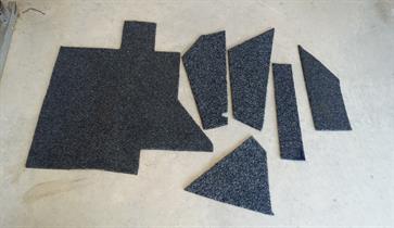 To provide a more professional, finished appearence to the drivers compartment, marine grade, waterproof carpet was installed. I selected a carpet without a pattern or ribs, which made it easier to cut and install with very little waste.  Templates were made for the various areas and the carpet cut to suit.