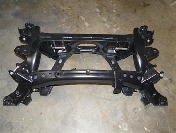 The original MX5 subframe appears rather heavy at first glance, but stripped to the bare bone like this it's surprisingly light.  Mazda engineers were very aware of the weght restrictions in designing the new NC model and weight was saved wherever possible.