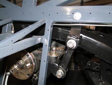All bolted in place.  Brackets and bolt can be accessed while the subframe is in the vehicle.